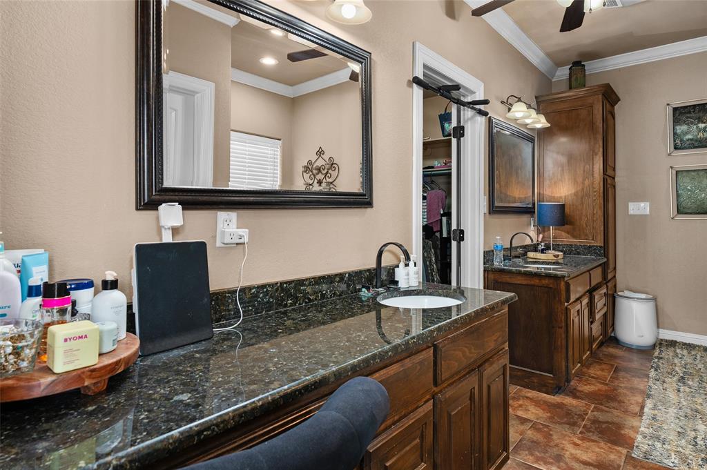 279 Lake Road Plain Dealing, LA 71064 - Photo 26 of 38 a bathroom with a granite countertop sink and a mirror