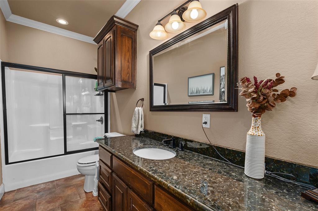 279 Lake Road Plain Dealing, LA 71064 - Photo 30 of 38 a bathroom with a granite countertop sink and a mirror