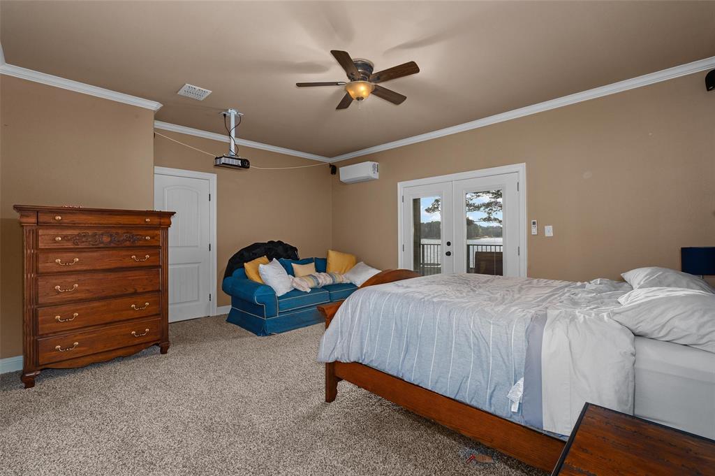 279 Lake Road Plain Dealing, LA 71064 - Photo 32 of 38 a bedroom with bed and window