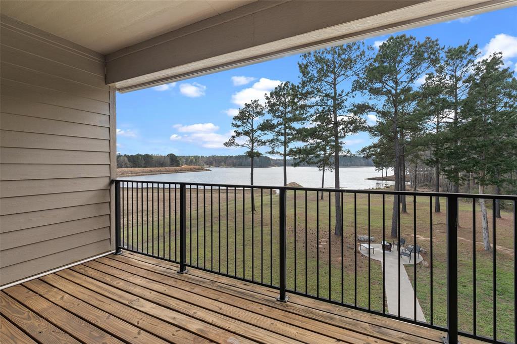 279 Lake Road Plain Dealing, LA 71064 - Photo 36 of 38 a view of a balcony with wooden floor