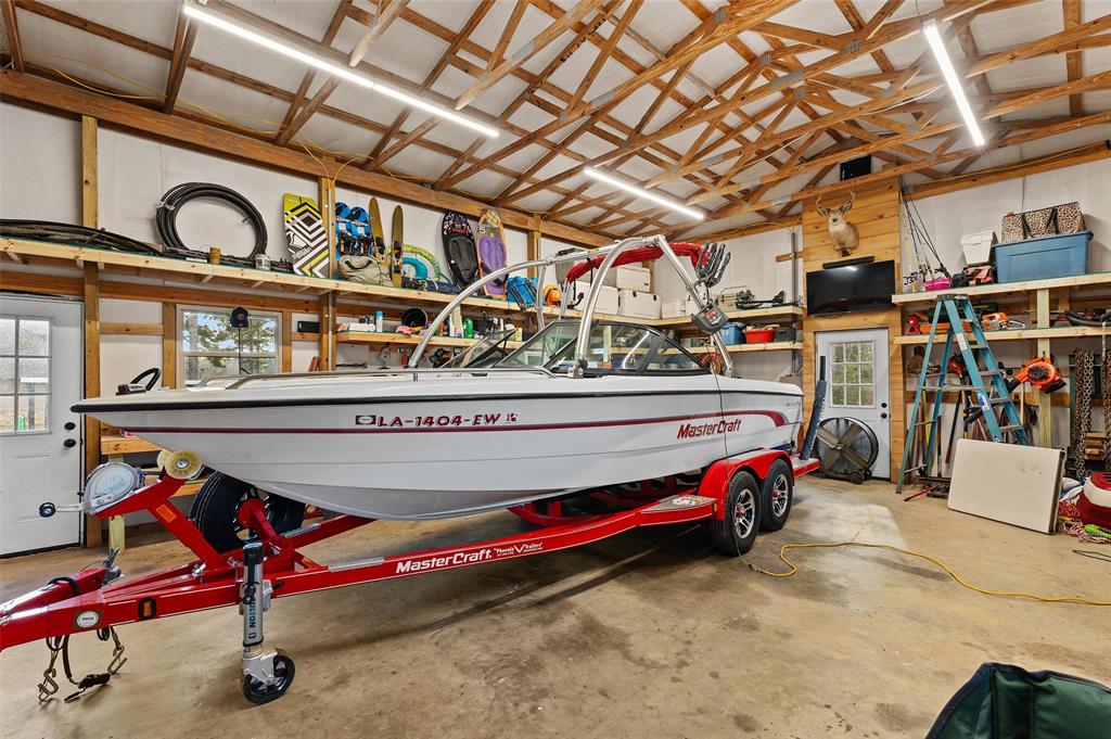 279 Lake Road Plain Dealing, LA 71064 - Photo 37 of 38 a utility room with closet dryer and windows