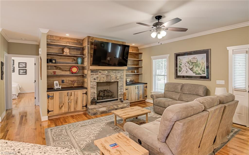 8958 Lasater Road Clemmons, NC 27012 - Photo 5 of 27 Rock face fireplace and built-in shelving