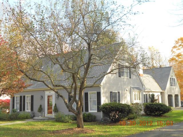 58 Standish Drive Ridgefield, CT 06877 - Photo 1 of 1 a front view of a house with a garden