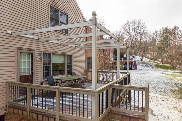 a view of wooden house with large windows