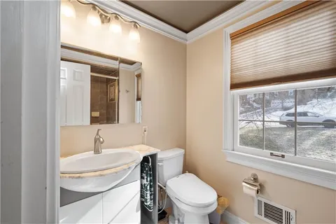 a bathroom with a shower and a sink