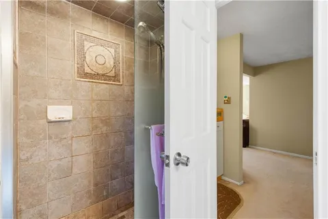 a bedroom with a bed and a desk