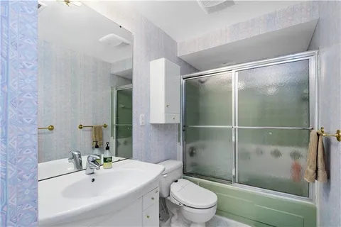 a bedroom with a bed chair and a window