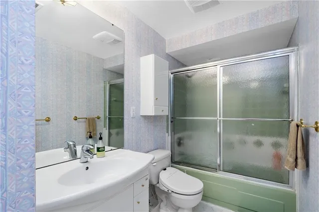 a bedroom with a bed chair and a window