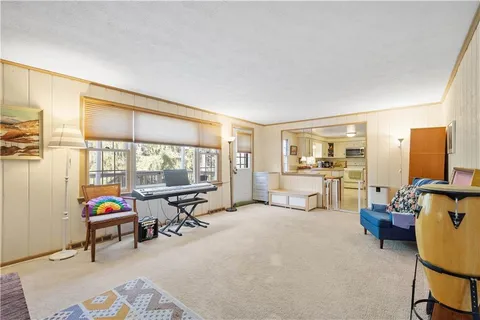 a living room with furniture and a table