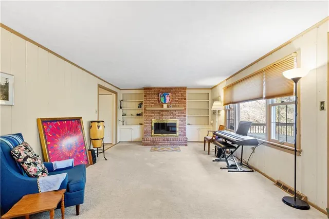 a living room with furniture flat screen tv and a fireplace