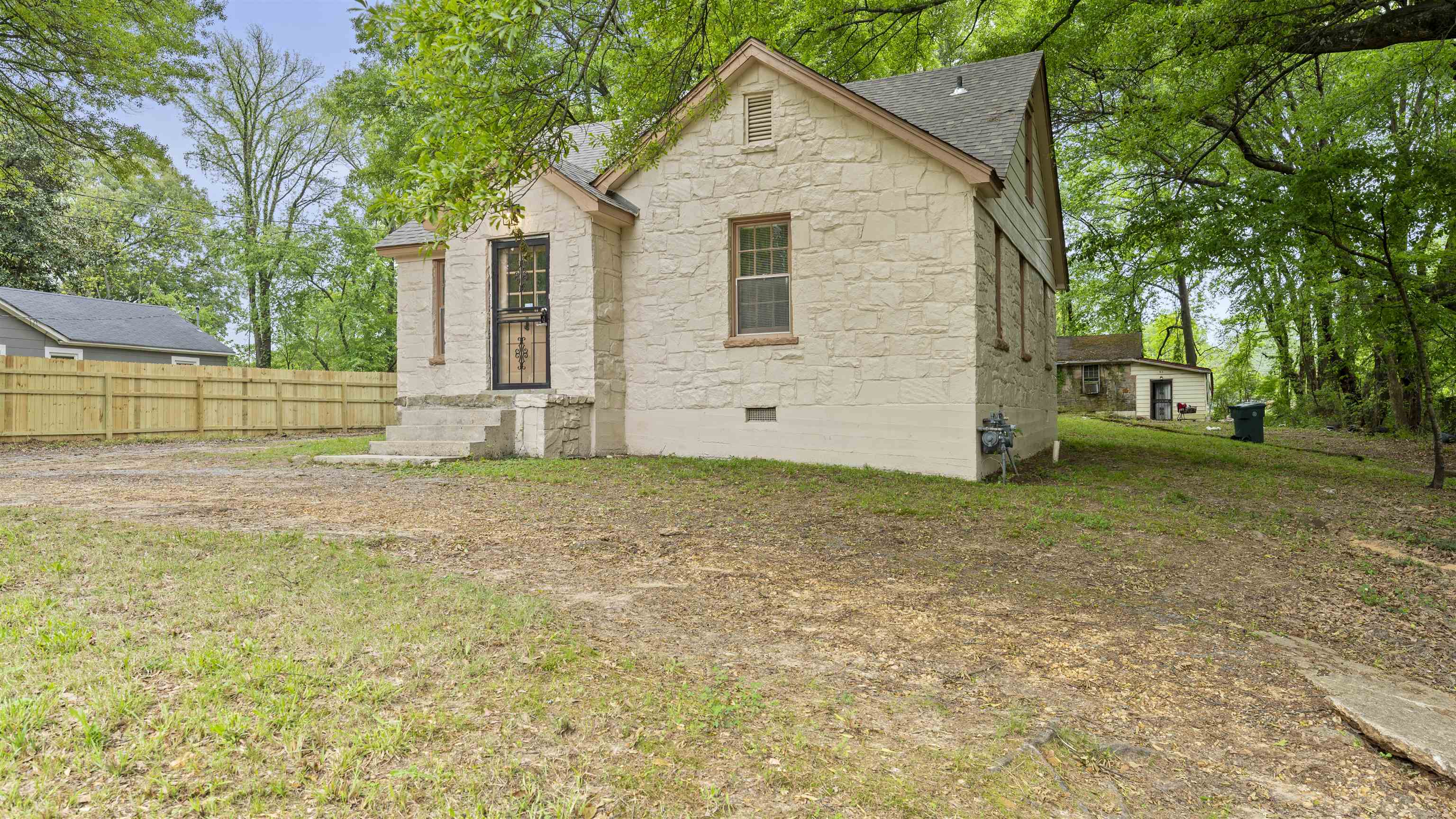 93 Eastman Road Memphis, TN 38109 - Photo 3 of 18 a view of a house with a yard