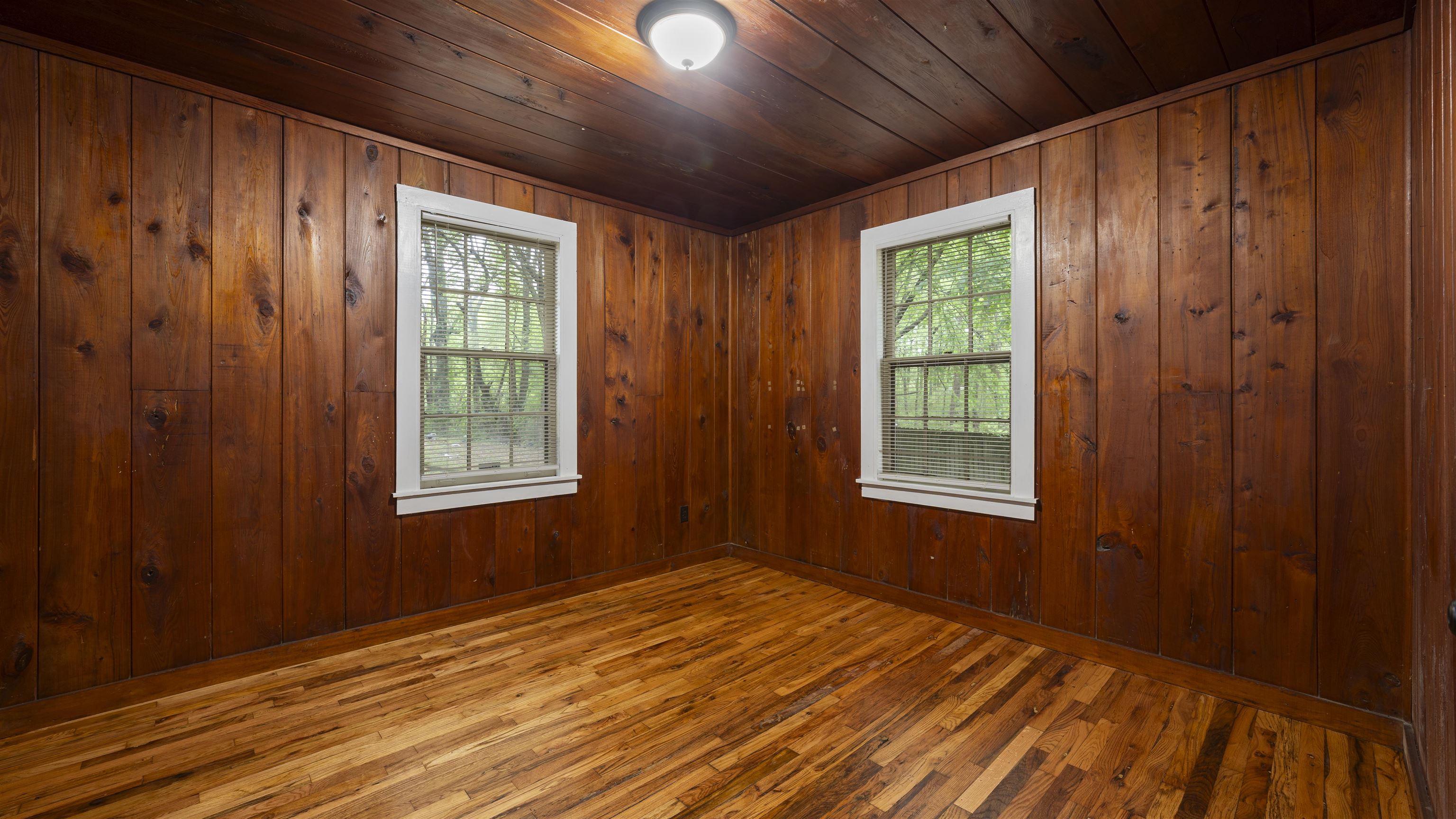 93 Eastman Road Memphis, TN 38109 - Photo 5 of 18 a view of empty room with wooden floor and fan