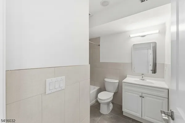 a view of a hallway with bathroom