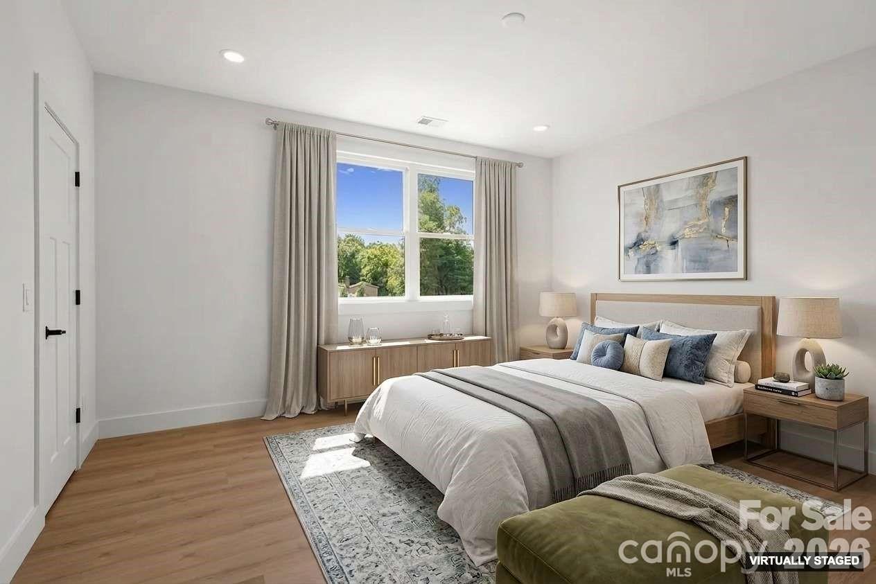 760 New Hope Road Flat Rock, NC 28731 - Photo 19 of 31 a bedroom with double bed and a window