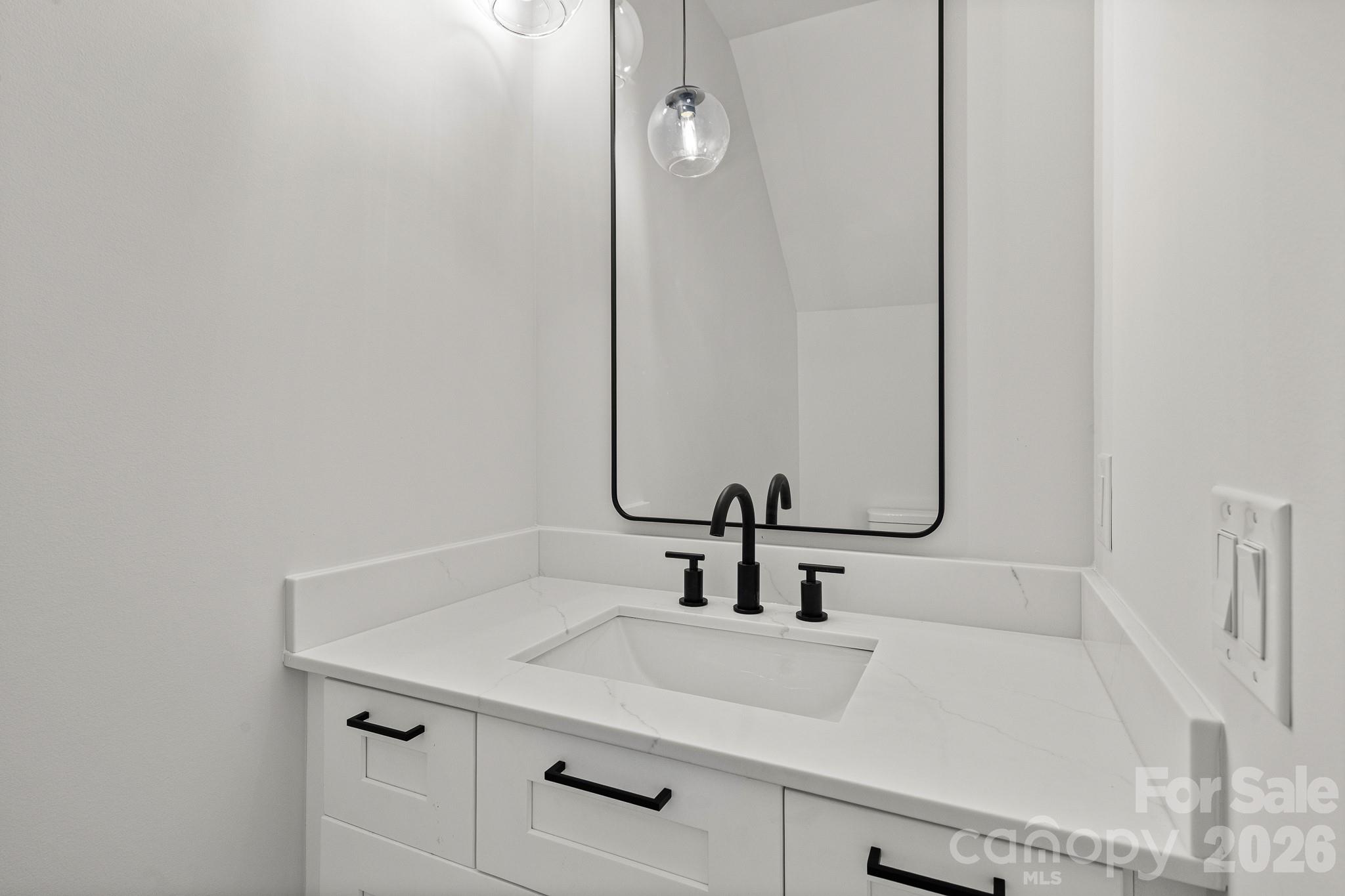 760 New Hope Road Flat Rock, NC 28731 - Photo 24 of 31 a bathroom with a sink and a mirror