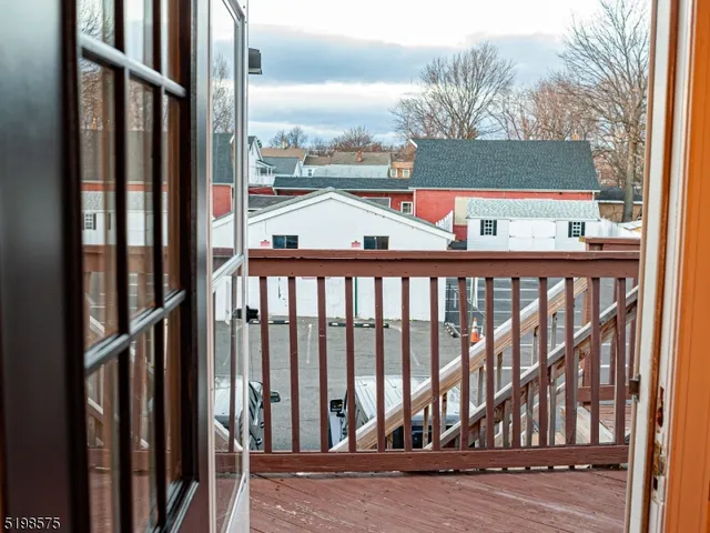a balcony with view of outdoor space