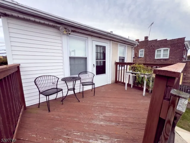 a view of a chairs and table in the balcony