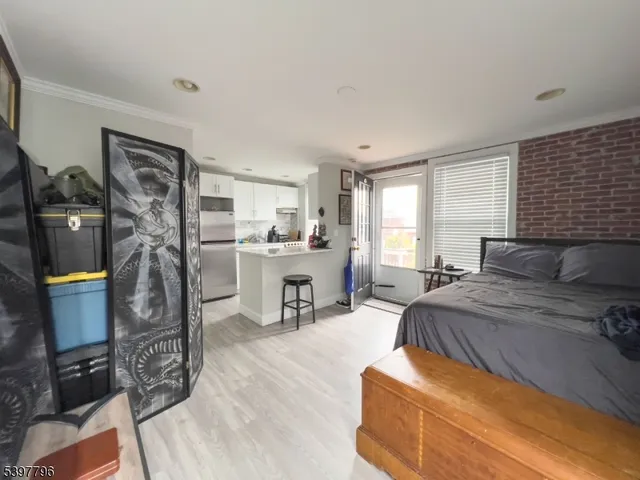 a bed room with furniture and a window