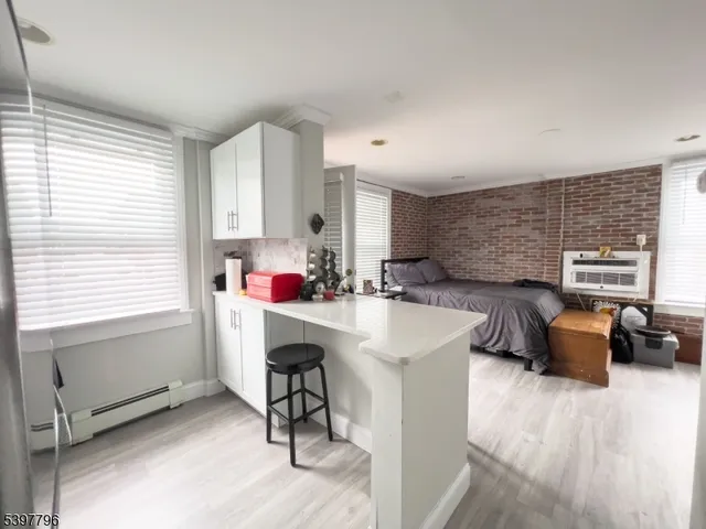 a very nice looking living room with furniture and a window