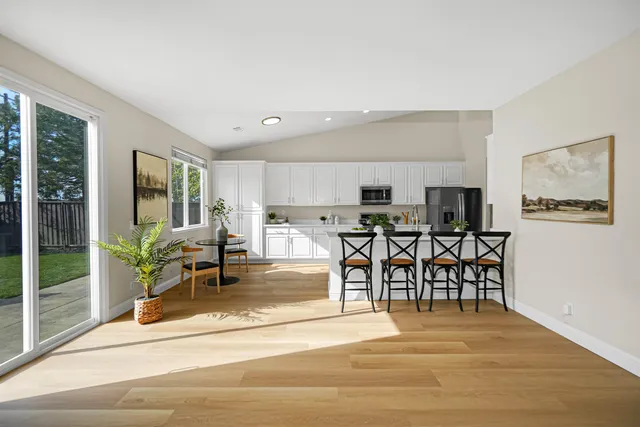 a view of a dining room with furniture window and outside view