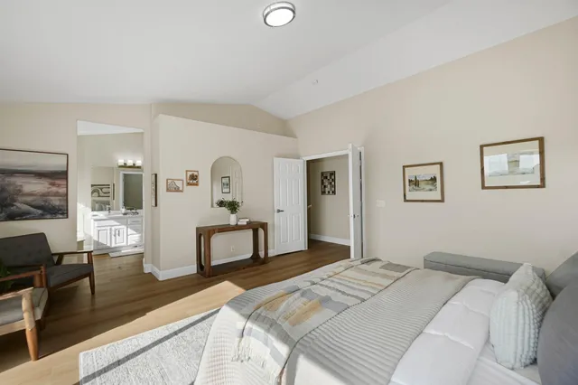 a bathroom with a tub a double vanity sink a mirror a shower and vanity