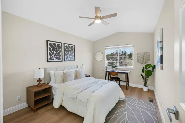a view of deck with wooden fence and a bench