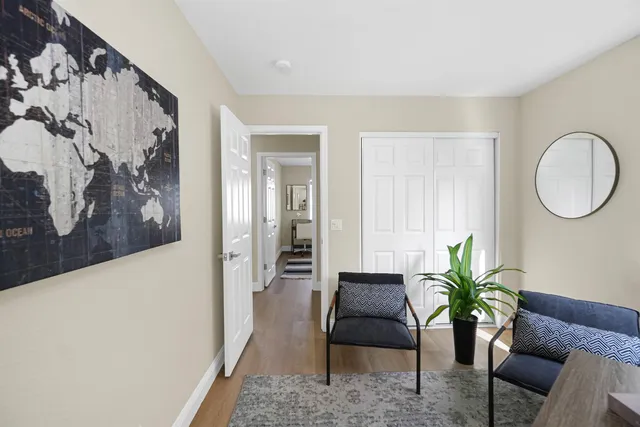 a view of a house with a yard porch and sitting area