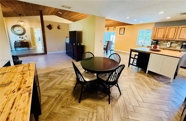 a view of a dining room with furniture