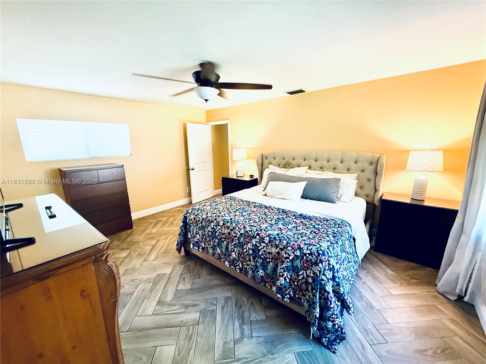 2980 Southwest 82nd Way Davie, FL 33328 - Photo 12 of 39 a bedroom with a bed and a dresser