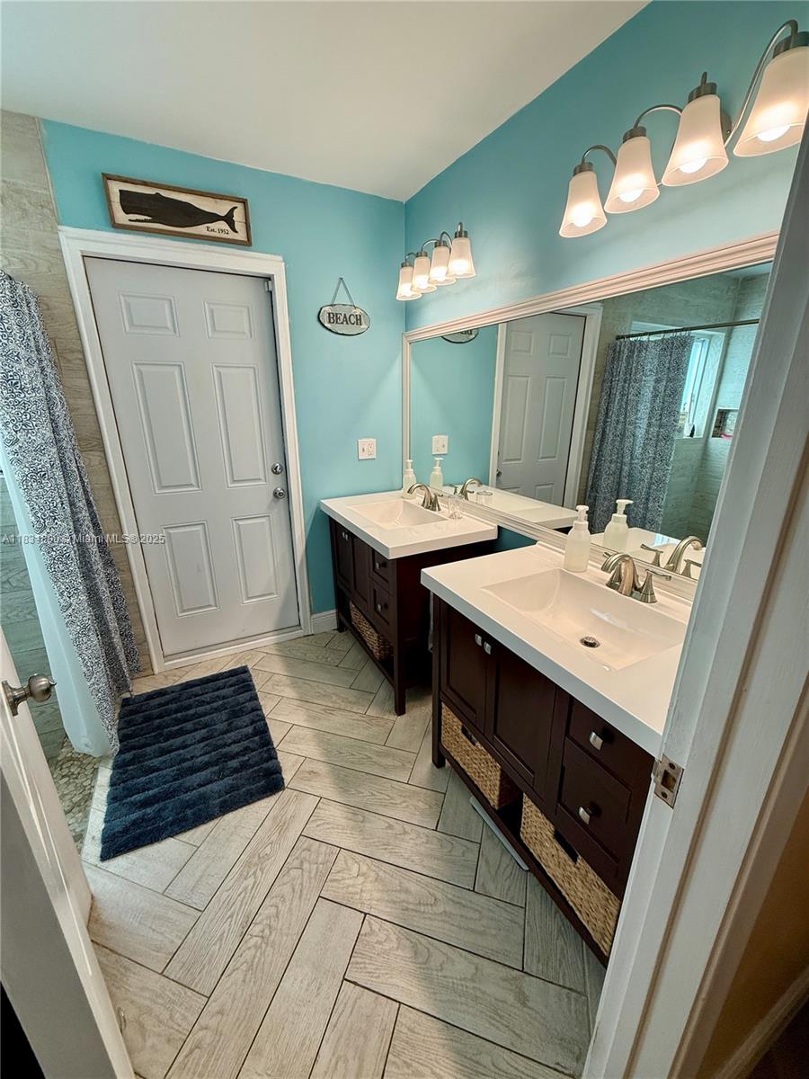2980 Southwest 82nd Way Davie, FL 33328 - Photo 15 of 39 a bathroom with a sink and a mirror