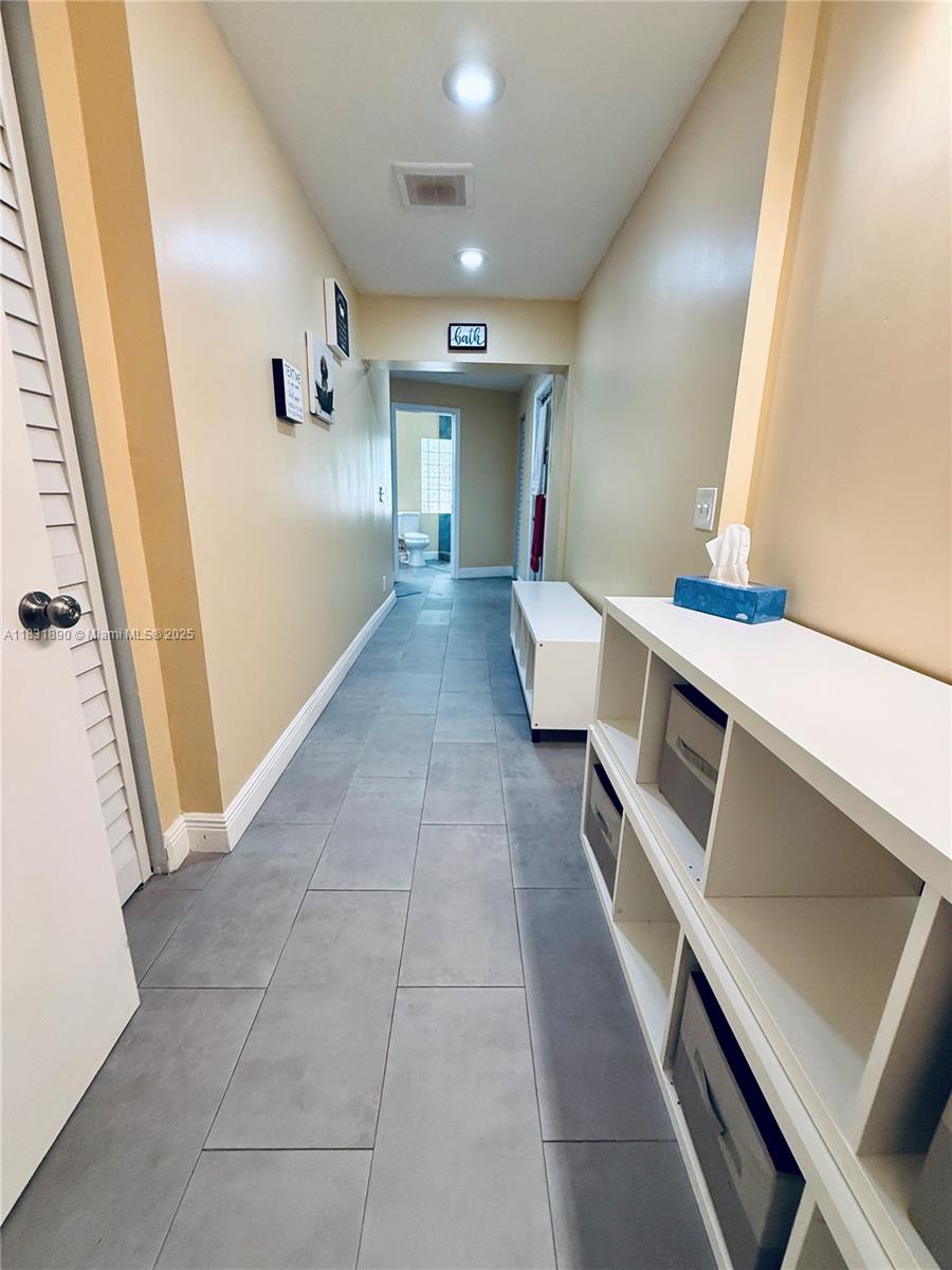 2980 Southwest 82nd Way Davie, FL 33328 - Photo 23 of 39 a view of a hallway with seating area