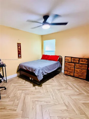 a bedroom with a bed and a cabinets