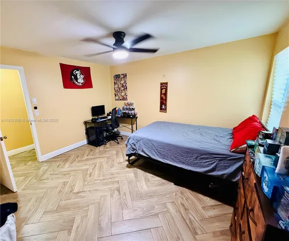 a bedroom with a bed and a dresser