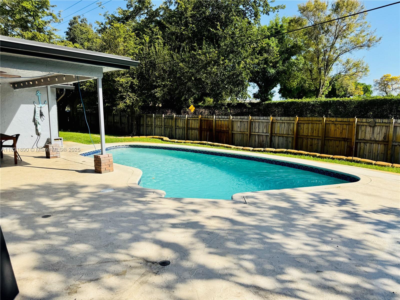 2980 Southwest 82nd Way Davie, FL 33328 - Photo 29 of 39 a view of a swimming pool with a yard