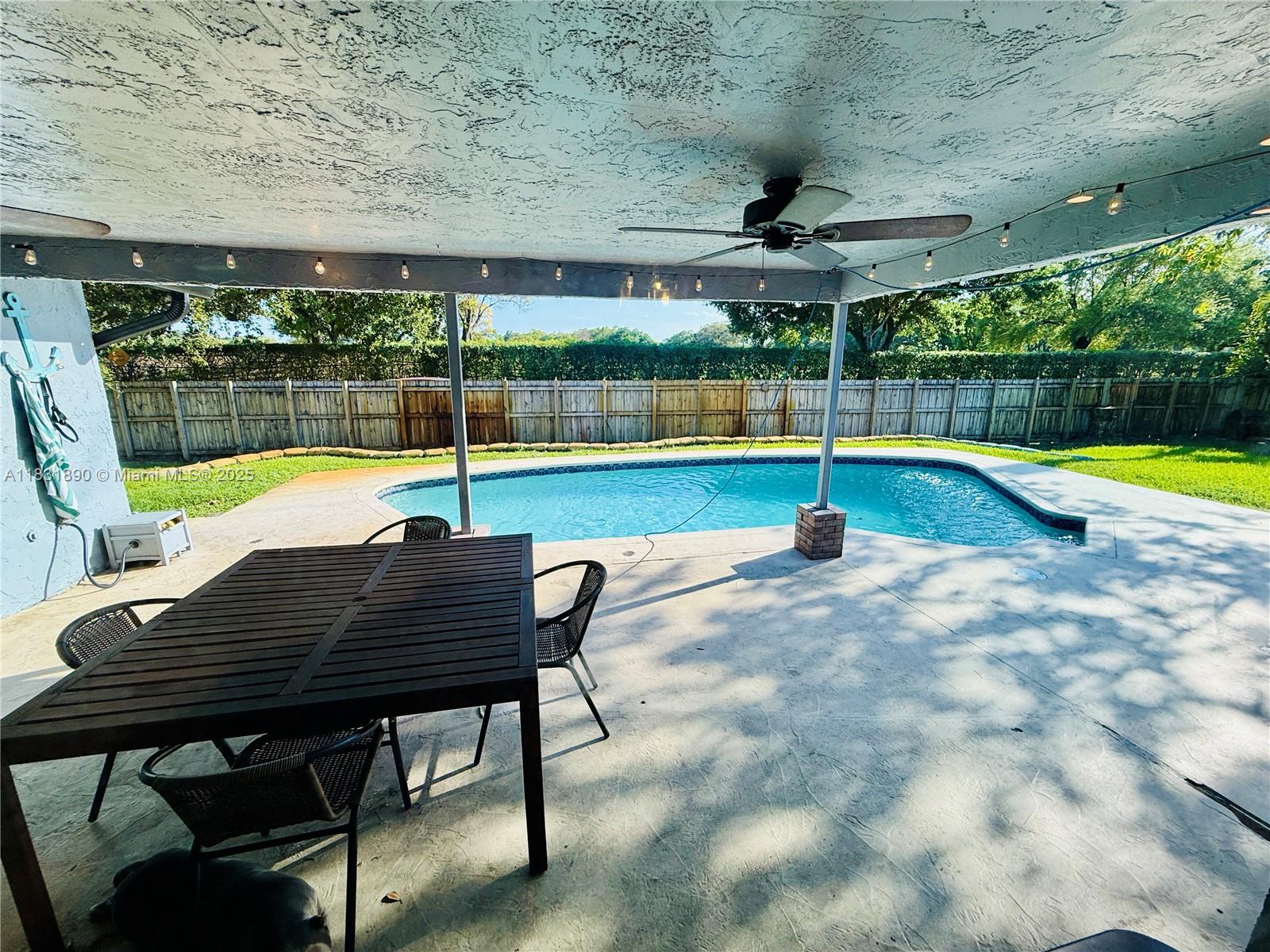 2980 Southwest 82nd Way Davie, FL 33328 - Photo 30 of 39 a view of a swimming pool with a deck
