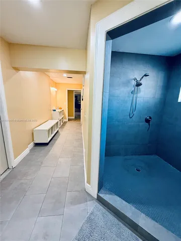 a bathroom with a bathtub and a shower