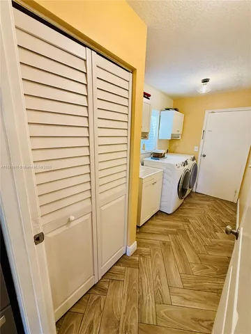 a view of a kitchen with a sink