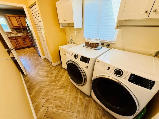 a utility room with dryer and washer