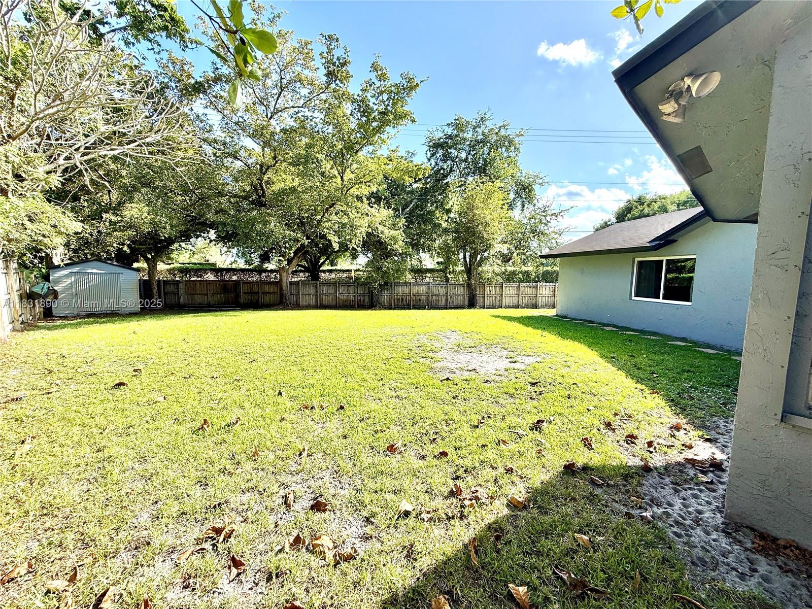 2980 Southwest 82nd Way Davie, FL 33328 - Photo 38 of 39 a view of a swimming pool with an outdoor space