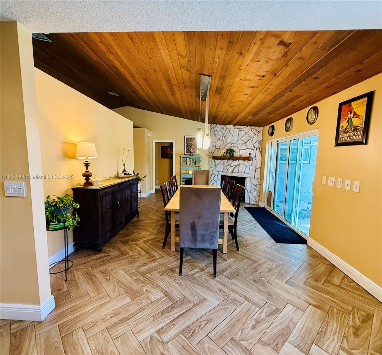 2980 Southwest 82nd Way Davie, FL 33328 - Photo 7 of 39 a living room with furniture a fireplace and a table