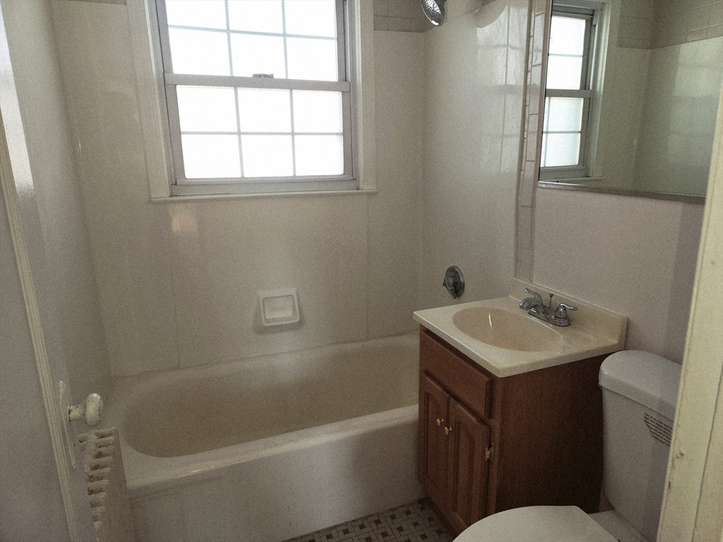 456 Cold Spring Avenue, Unit 2A West Springfield, MA 01089 - Photo 13 of 13 a bathroom with a sink toilet vanity and bathtub