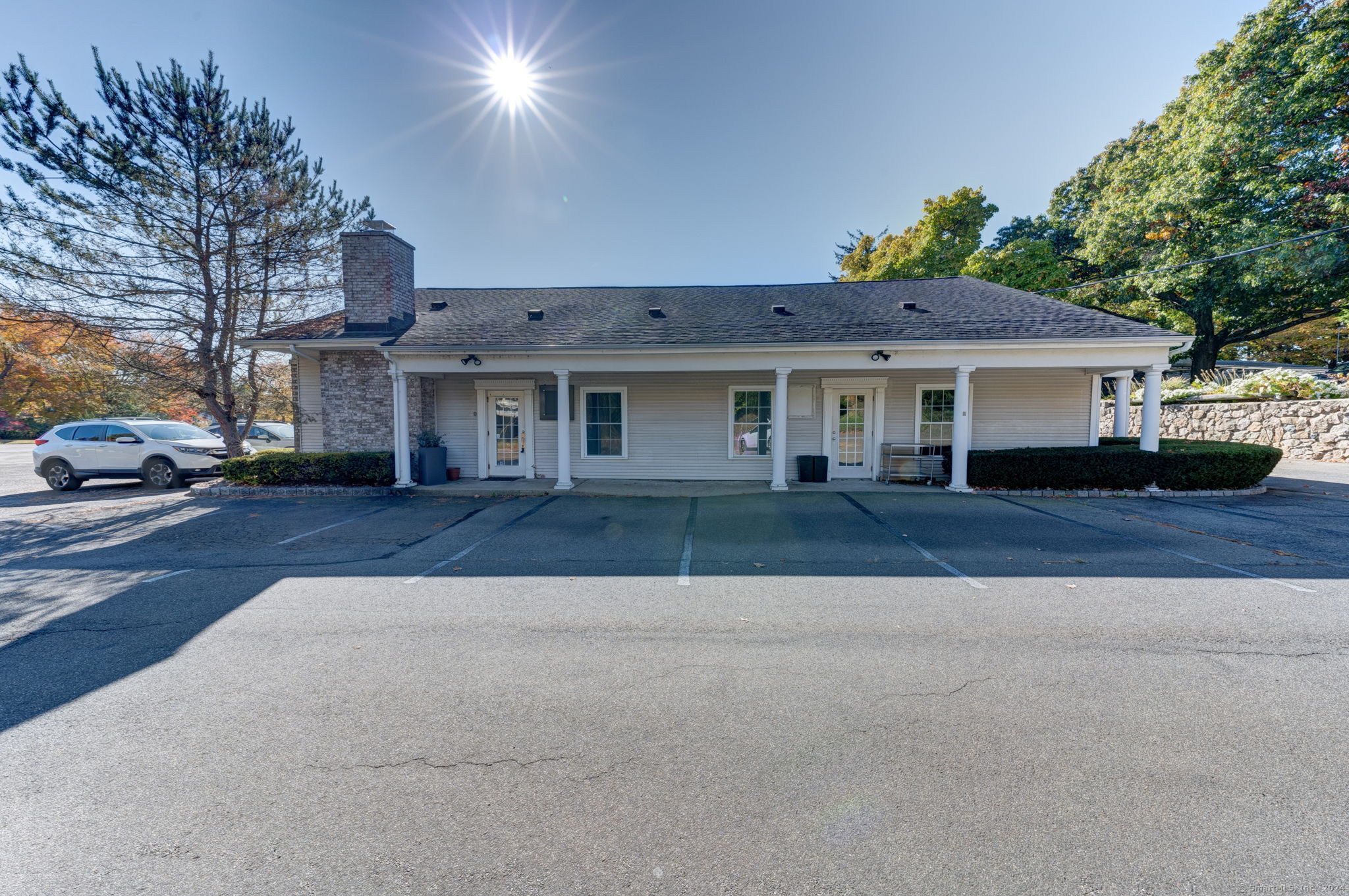168 Boston Post Road, Unit 1 & 2 Madison, CT 06443 - Photo 1 of 1 a front view of a house with a yard