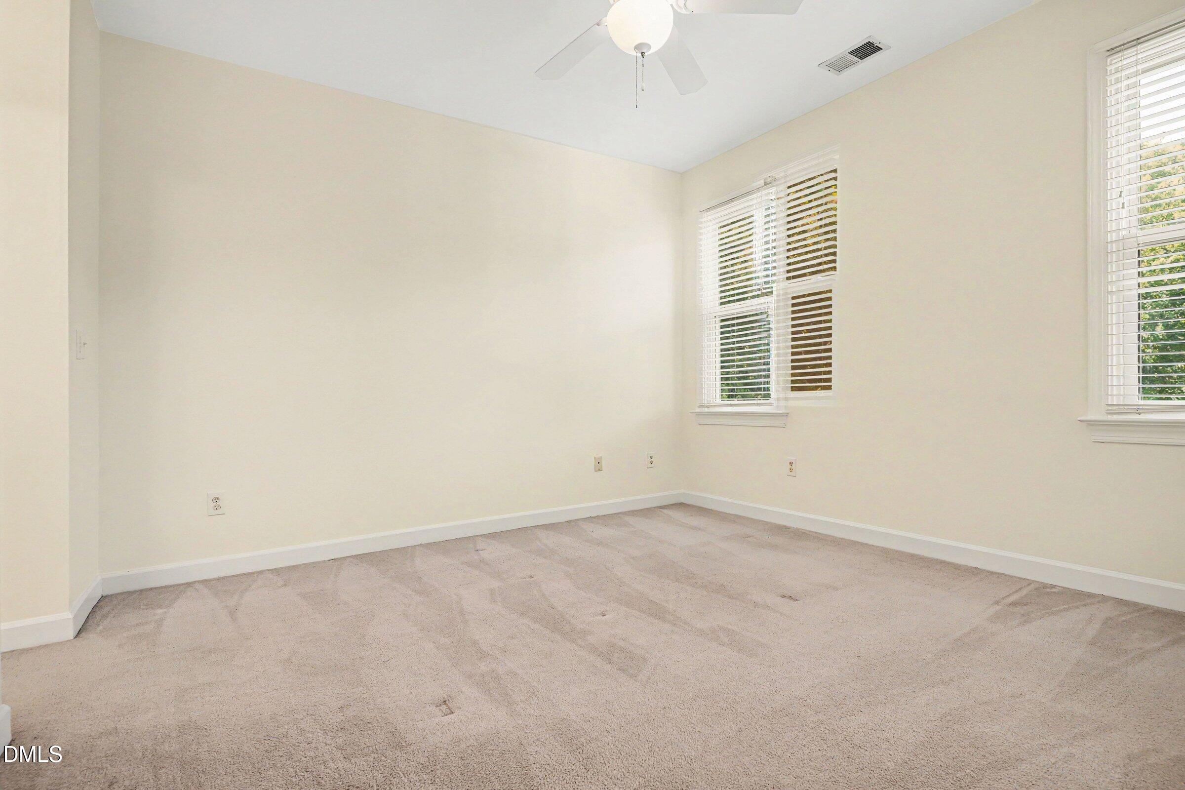 2651 Mellowfield Drive, Unit 203 Raleigh, NC 27604 - Photo 9 of 32 an empty room with a window
