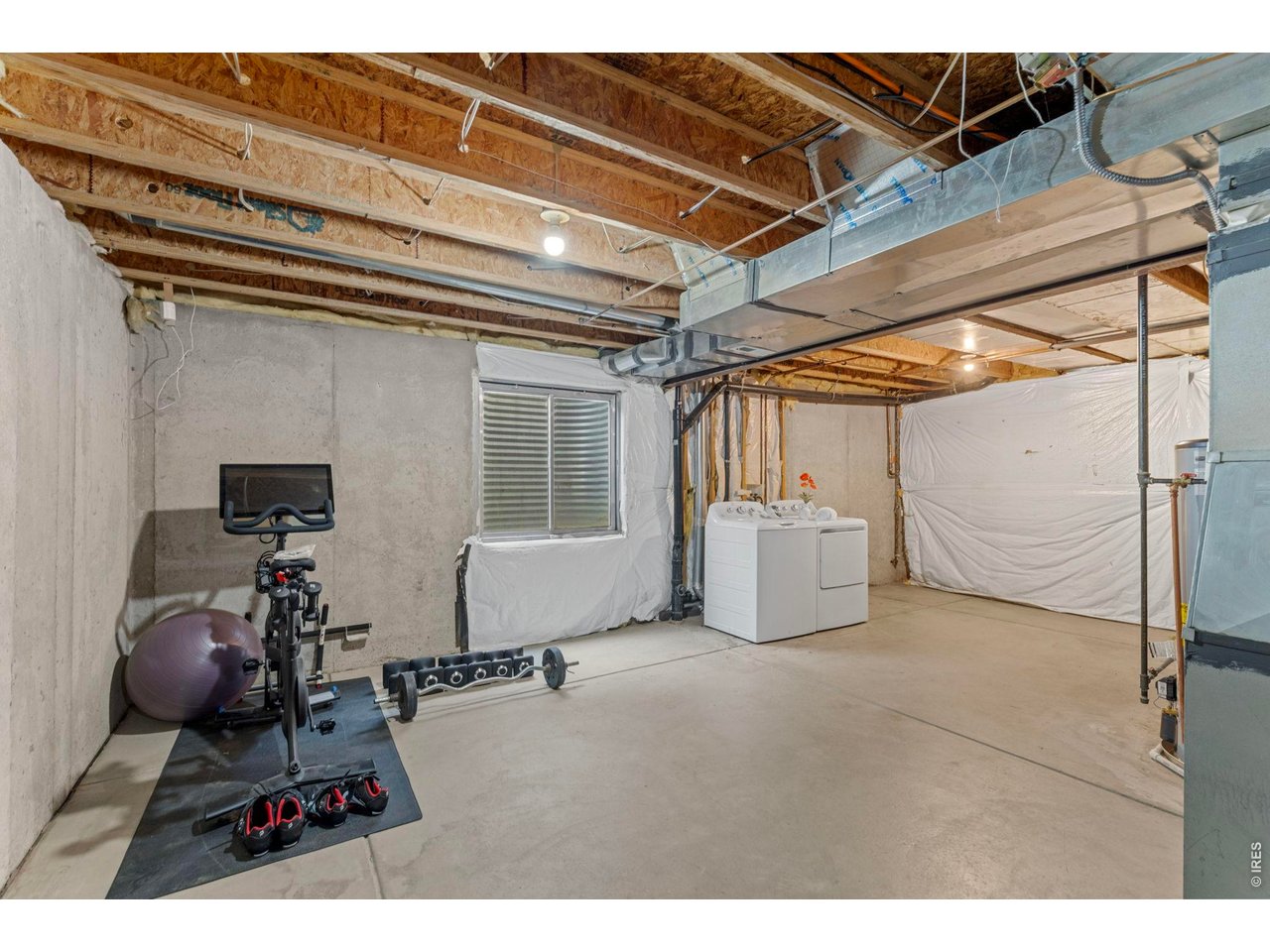 6531 St Vrain Ranch Boulevard Firestone, CO 80504 - Photo 22 of 30 a view of a room with gym equipment
