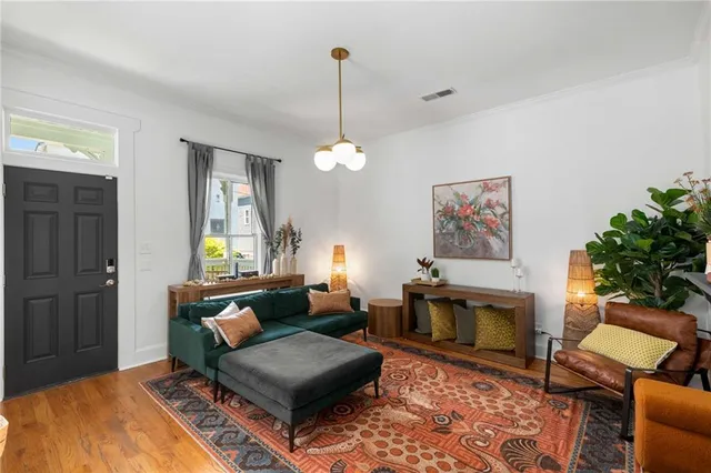 a bedroom with furniture and a chandelier