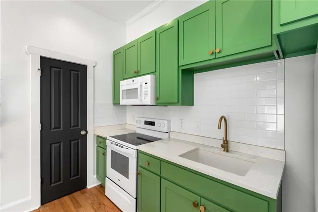 a kitchen with a refrigerator and a sink