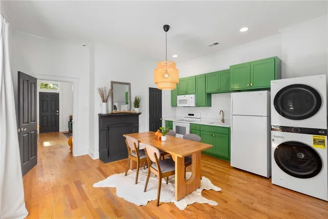 a spacious bathroom with a granite countertop sink a toilet a tub and shower