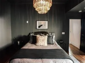 a view of a backyard with table and chairs and wooden fence