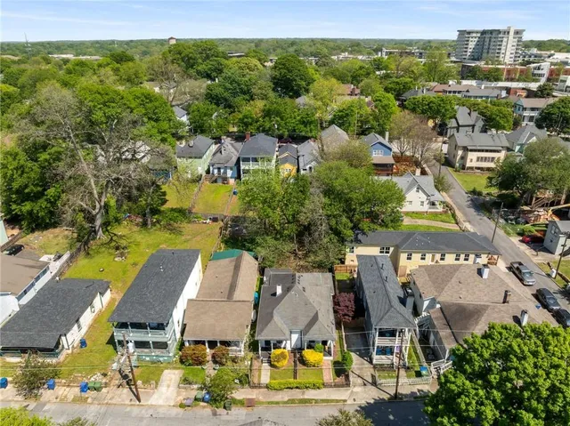 a view of a cafe with sitting area