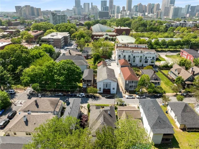 a view of people sitting in front of shop